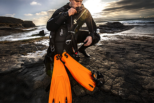 Scuba diver on shore with GO Sport Gorilla Fins