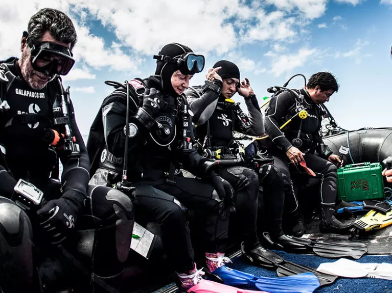 divers on a boat